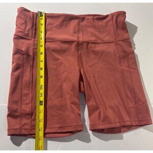 Athleta Ultimate Stash Pocket 7" Biker Shorts L Rust